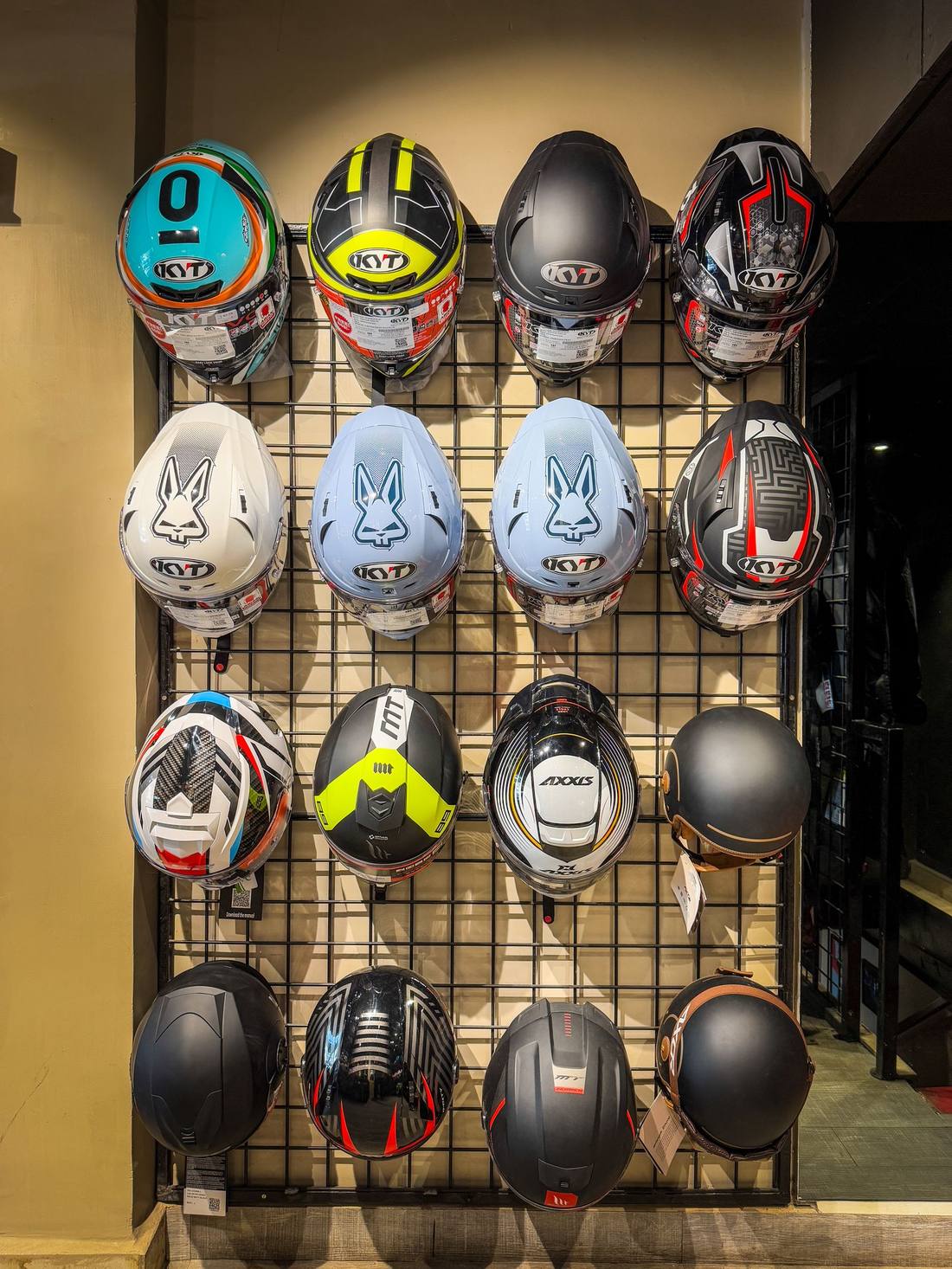 Full-face and modular helmet wall at Bikester Global Malad