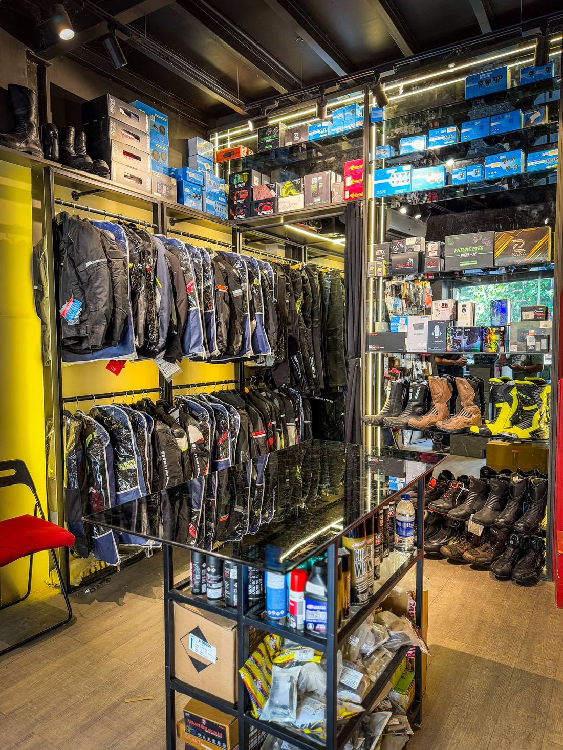 Riding jackets, boots and electronics section at Bikester Global Malad