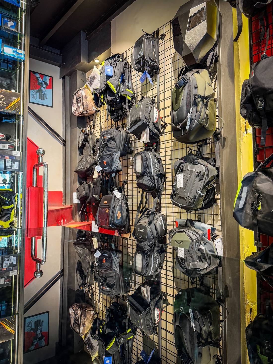 Touring luggage and tank bag wall at Bikester Global Malad