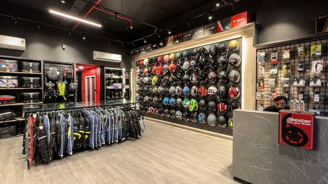 Bikester Global Mira Road store interior with full helmet wall