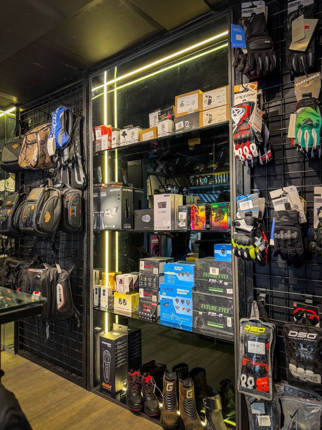 Riding gloves and accessories wall at Bikester Global Santacruz