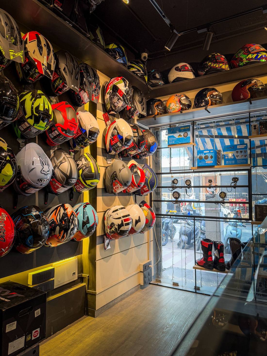 Helmet display wall at a Bikester Global store
