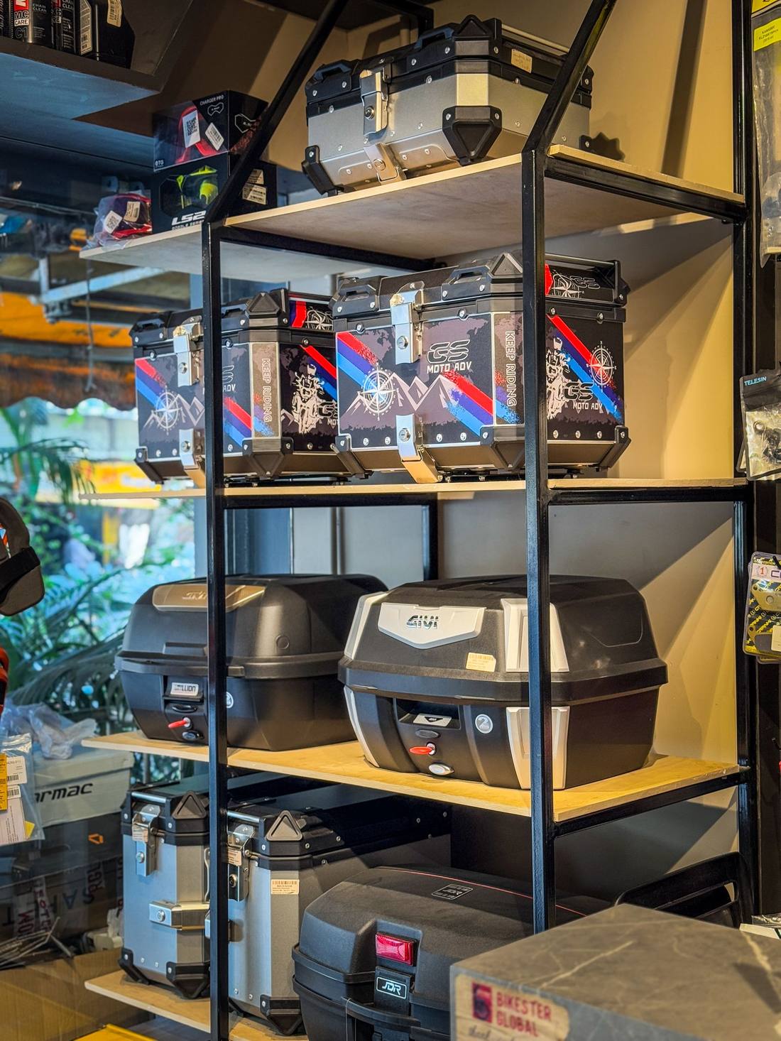 Touring pannier and top-box display at a Bikester Global store